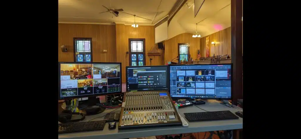Live-stream and audio control station with mixing console and monitors installed by Horus Community Services for a church in Trumansburg, NY