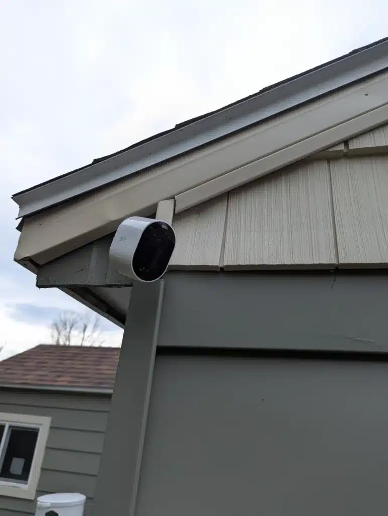 Outdoor security camera mounted under a roof eave on a home by Horus Community Services in Trumansburg, NY