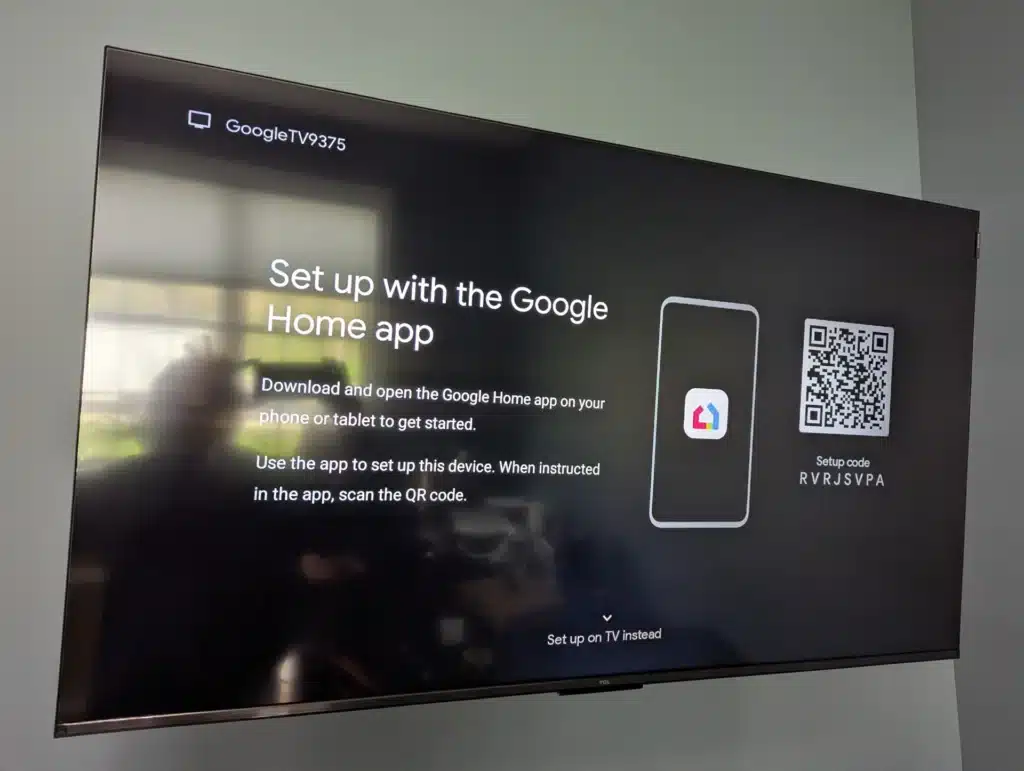 Newly wall-mounted TV showing the Google Home setup screen during a Horus Community Services install in Trumansburg, NY