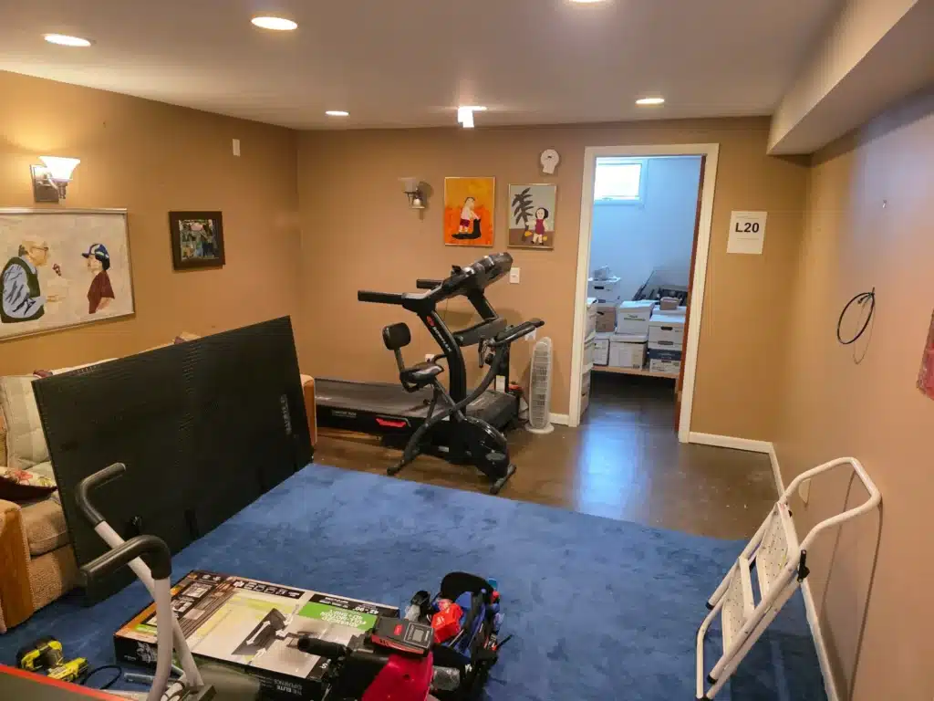 Home gym TV mounting project with tools and equipment prepared by Horus Community Services in Trumansburg, NY