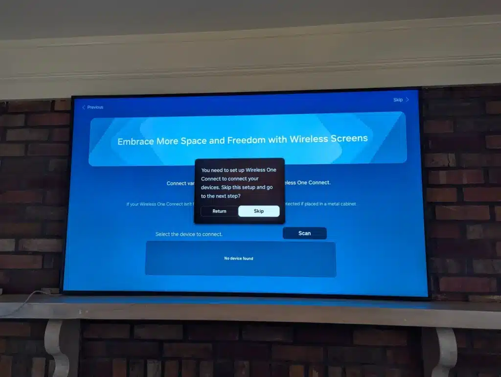 Brick-mounted Samsung TV showing the Wireless One Connect setup during a Horus Community Services install in Trumansburg, NY