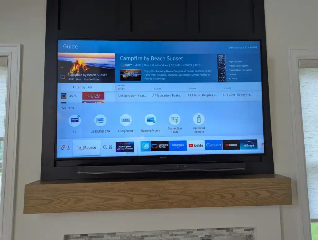 Completed wall-mounted TV with soundbar on a floating shelf by Horus Community Services in Trumansburg, NY